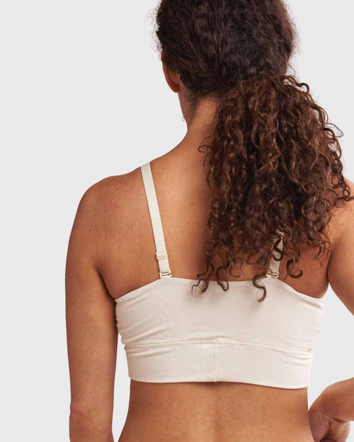Ivory / Flat & pocketed leisure bra with mesh panel sides and underwire free designs on flat model back view