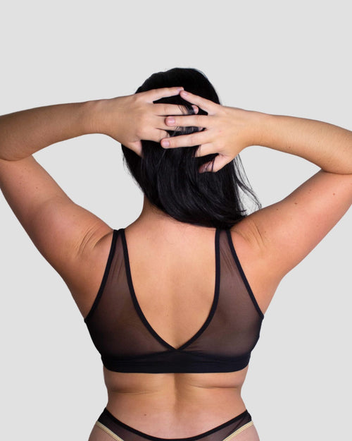 Black / Implants & pocketed mesh plunge neckline bralette on implants model, pocketed for breast forms is desired or needed lifestyle image