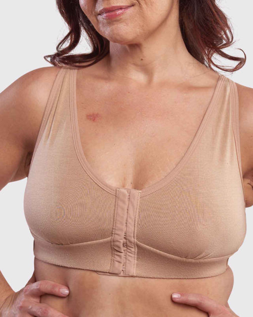 Sand / Lumpectomy & pocketed front closure wireless bra with soft modal material and convertible & adjustable straps on model