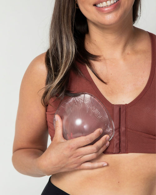Clear & 2-3 size difference evenly breast form with model holding it to her chest