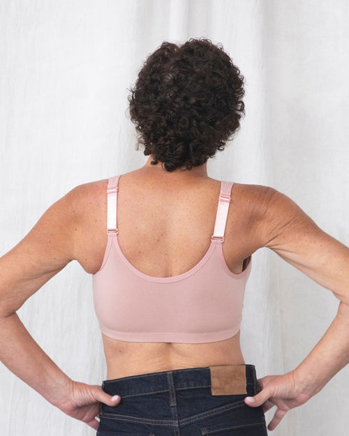 Blush / Flap Reconstruction & pocketed front closure bra with soft wire free cups and adjustable straps on diep flap model side view