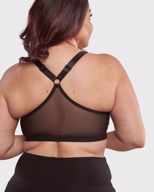 Black / Au Natural & pocketed front closure sports bra with mesh back panel and adjustable straps on au natural model back view