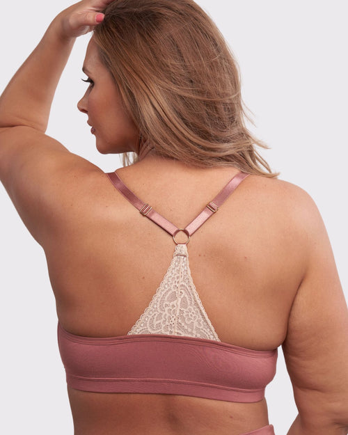 Dusty Rose / Lumpectomy & pocketed front closure lace racerback bra with a plunging neckline and soft wire free cups on lumpectomy model.