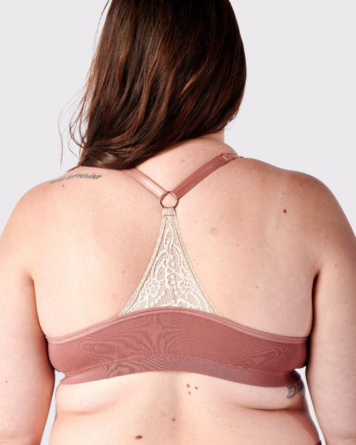 Dusty Rose / Lumpectomy & pocketed front closure lace racerback bra with a plunging neckline and soft wire free cups on lumpectomy model.