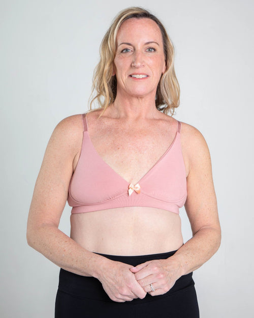 Blush / Flap Reconstruction & pocketed plunge t-shirt bra with soft wire free cups, back hook closure and adjustable straps on model.