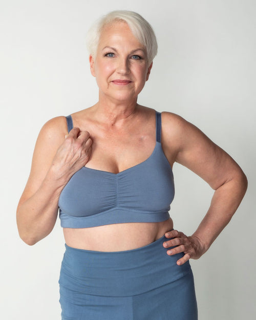 Slate / Flap Reconstruction & pocketed full coverage t-shirt bra with soft wire free cups, back hook closure and adjustable straps on model.