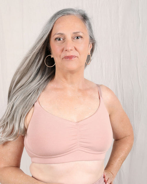 Sand / Implants & pocketed full coverage t-shirt bra with soft wire free cups, back hook closure and adjustable straps on implant model.