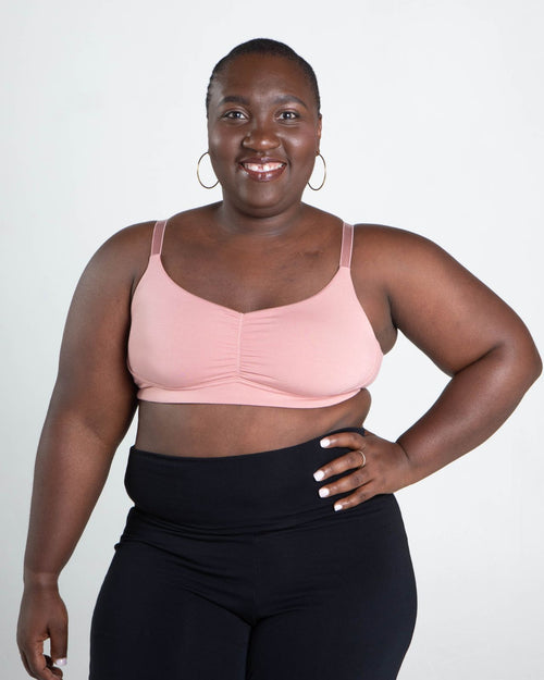 Blush / Mastectomy & pocketed full coverage t-shirt bra with soft wire free cups, back hook closure and adjustable straps on model.