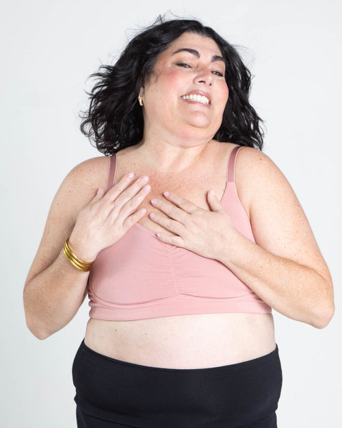 Blush / Mastectomy & pocketed full coverage t-shirt bra with soft wire free cups, back hook closure and adjustable straps on model.