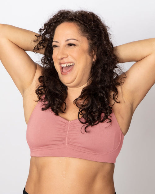 Blush / Mastectomy & pocketed full coverage t-shirt bra with soft wire free cups, back hook closure and adjustable straps on model.