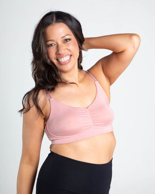 Blush / Mastectomy & pocketed full coverage t-shirt bra with soft wire free cups, back hook closure and adjustable straps on model.
