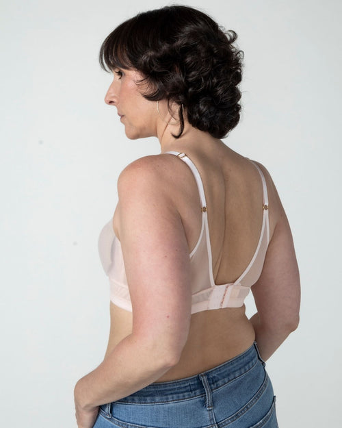 Blush / Au Natural & model wearing the Victoria Pocketed Keyhole bralette with gold lace trim and gold jewel that says anaono side view