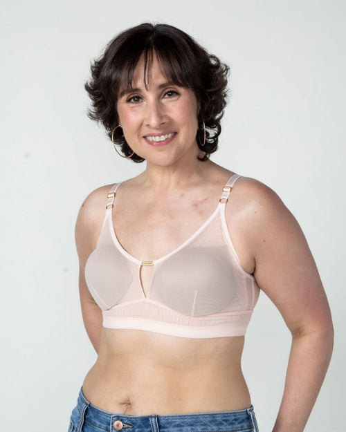 Blush / Au Natural & model wearing the Victoria Pocketed Keyhole bralette with gold lace trim and gold jewel that says anaono side view