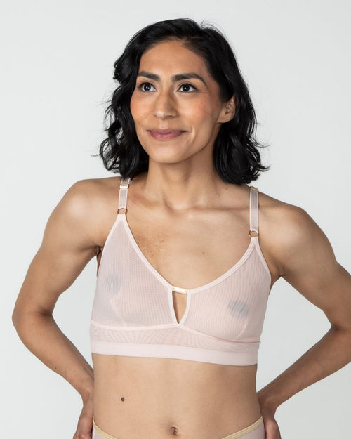 Blush / Flap Reconstruction & model wearing the Victoria Pocketed Keyhole bralette with gold lace trim and gold jewel that says anaono