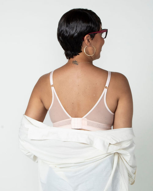 Blush / Au Natural & model wearing the Victoria Pocketed Keyhole bralette with gold lace trim and gold jewel that says anaono side view