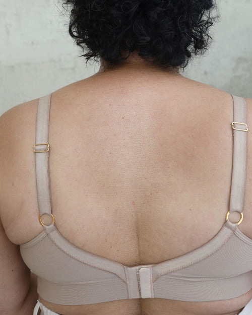 Latte / Implants & Front chest view of the Brenda Pocketed Mesh Bra in latte, featuring a sheer V-neckline and a smooth, sheer wire-free plunge bra silhouette.