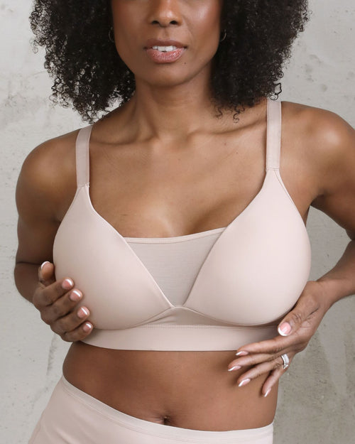 Latte / Implants & Front chest view of the Brenda Pocketed Mesh Bra in latte, featuring a sheer V-neckline and a smooth, sheer wire-free plunge bra silhouette.