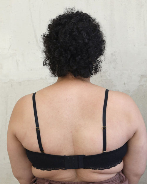 Black / Flat & Front view of the Tammi full coverage lace bralette in black, showing the feminine lace trim neckline and smooth, wire-free fit.