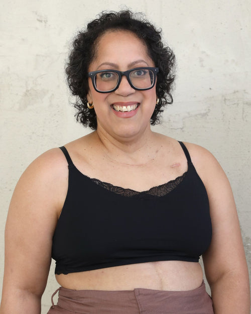 Black / Flat & Front view of the Tammi full coverage lace bralette in black, showing the feminine lace trim neckline and smooth, wire-free fit.