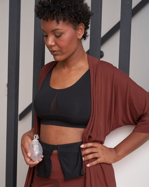 Sienna & Model holding the additional drain belt pocket while wearing the Miena post surgery super soft robe