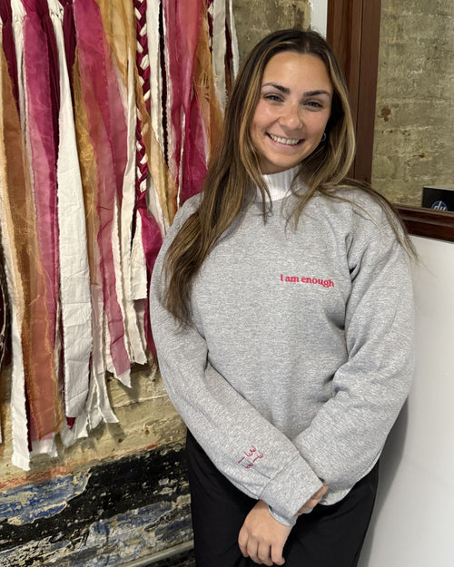 Gray & i am enough crewneck front view on model