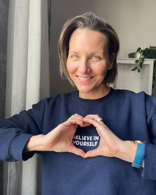 Navy & front view of the Believe in yourself crew neck on model
